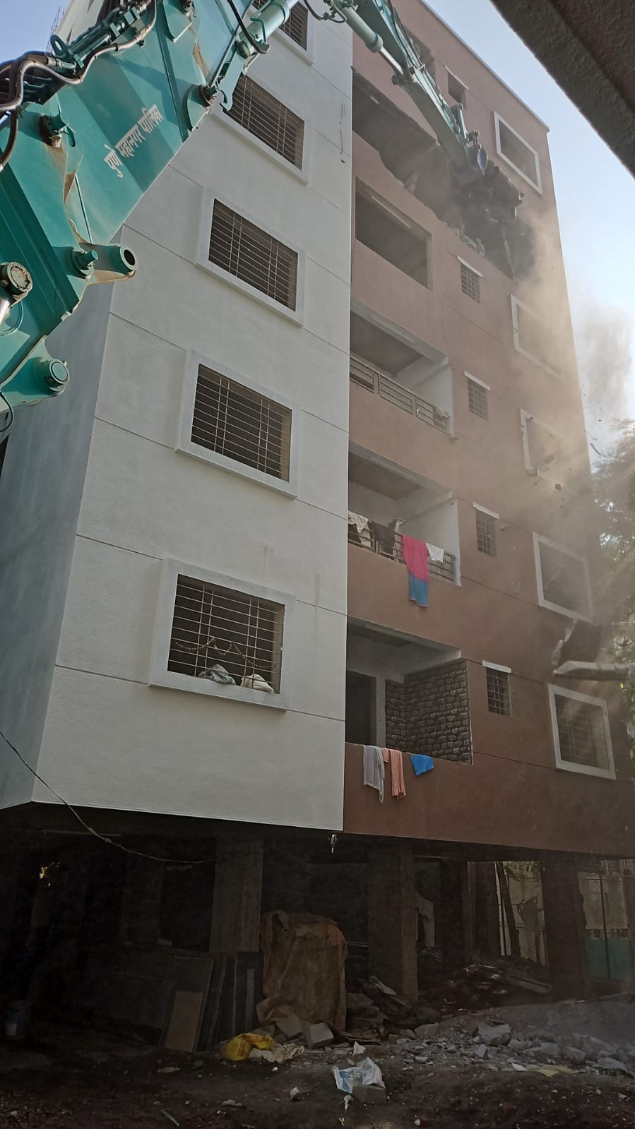 Action by PMC on 11 unauthorized buildings near Sinhagad College in Ambegaon